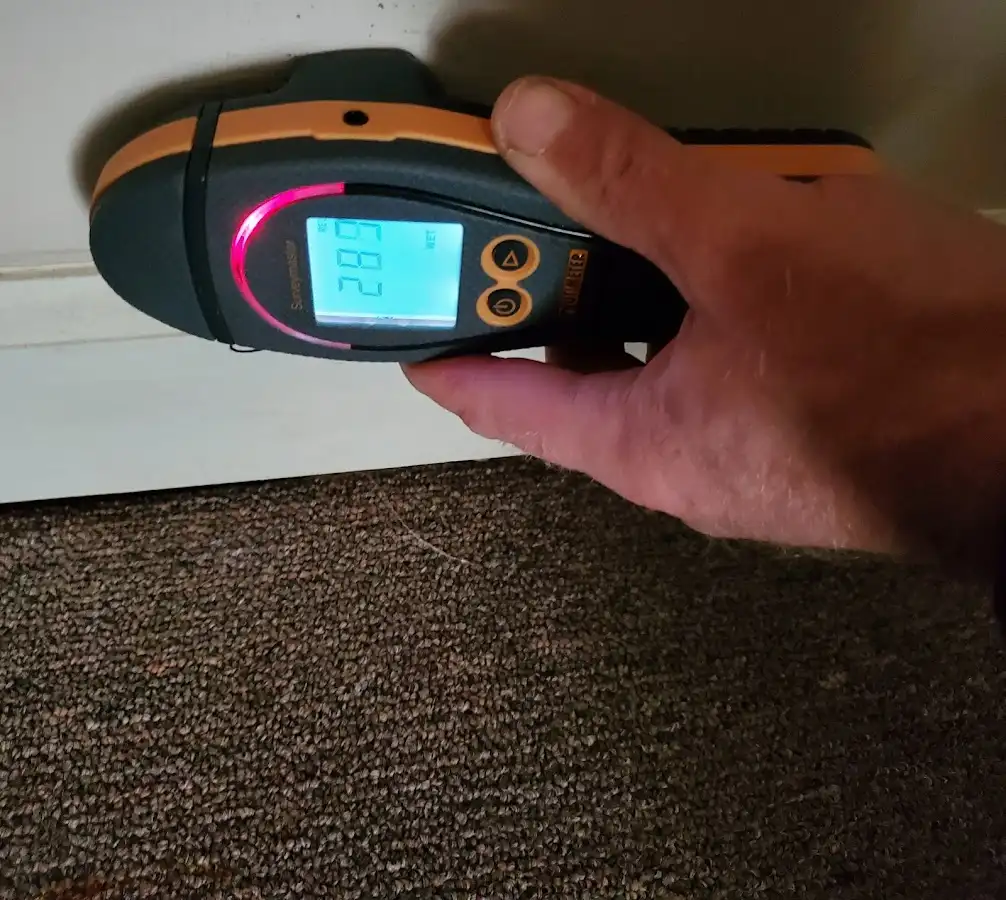 Moisture detection at baseboard during Storm Damage Restoration in Exeter